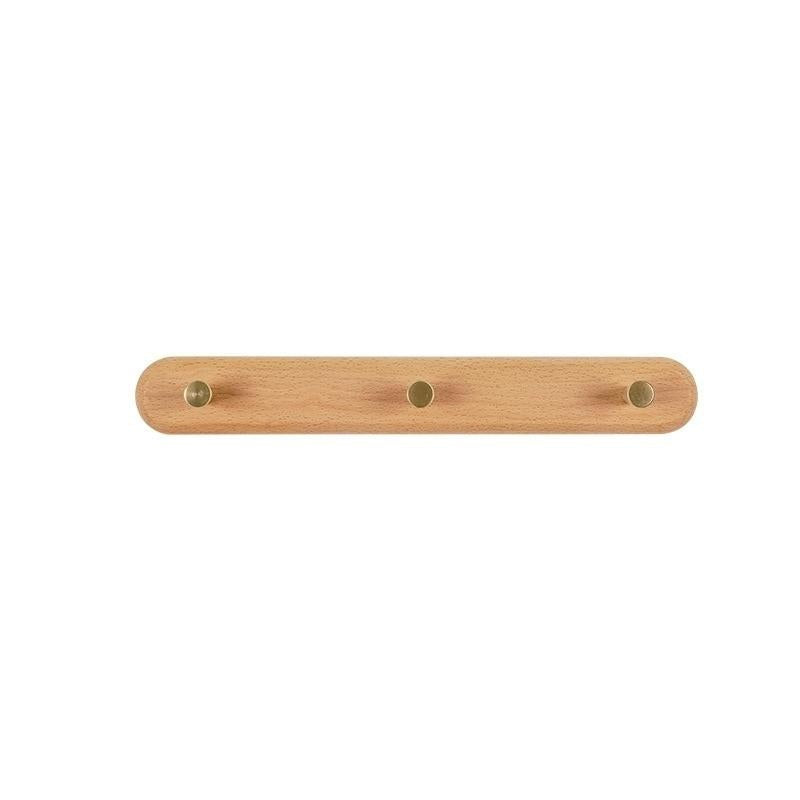 Brunn – Wandhakenleiste aus Massivholz & Messing