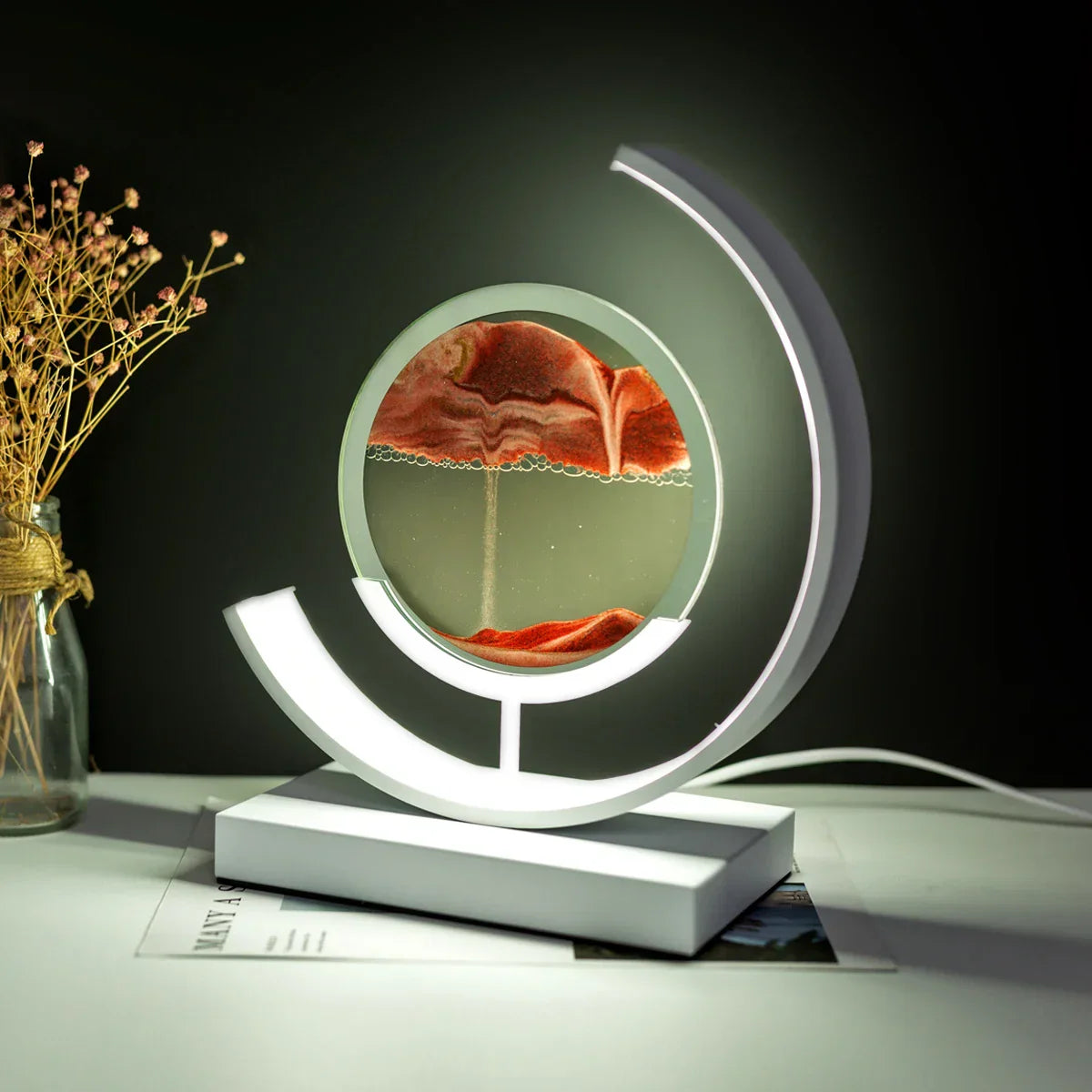 LED table lamp with quicksand effect