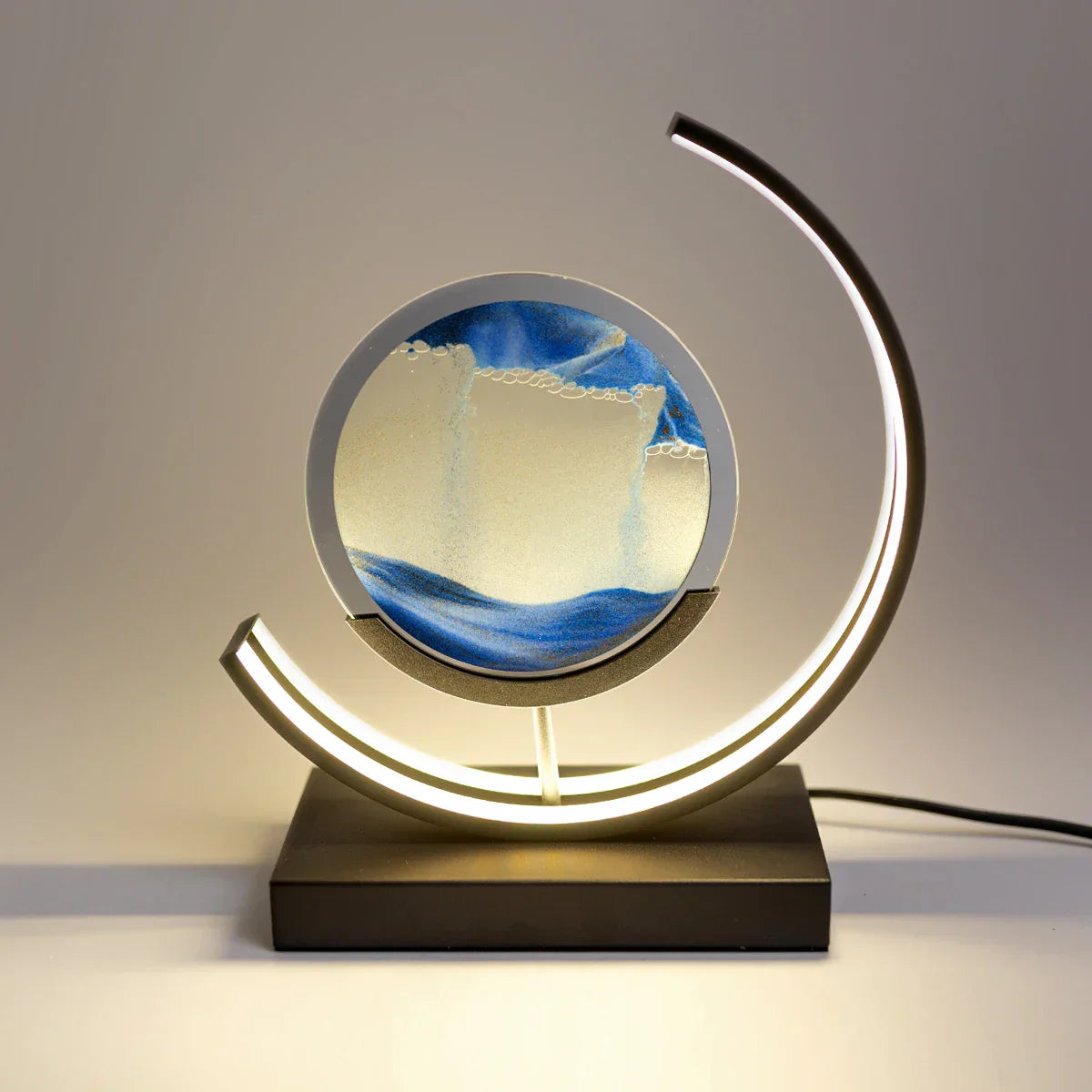 LED table lamp with quicksand effect