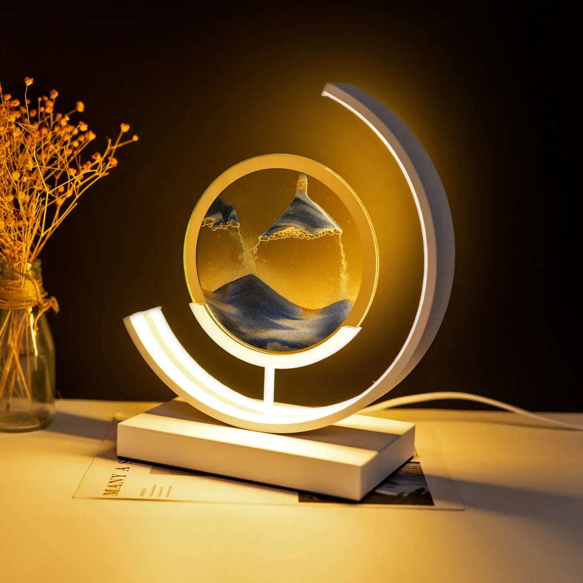 LED table lamp with quicksand effect