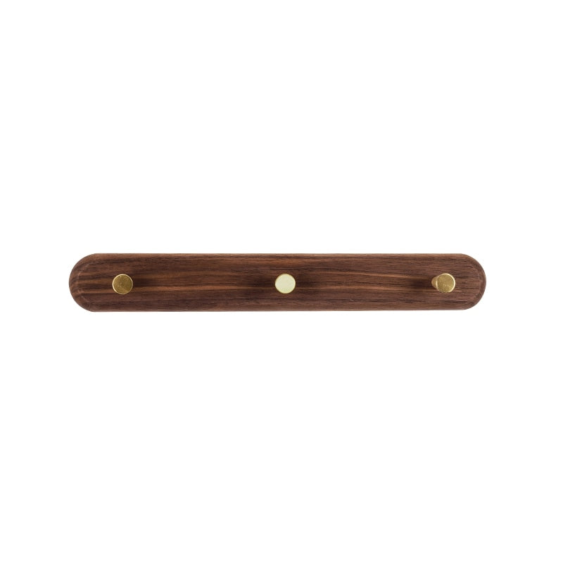 Brunn – Wandhakenleiste aus Massivholz & Messing